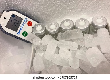 Sodertalje-Sweden - January 2021: Glass Vials With Crimp Caps And Hoarfrost On Dry Ice Very Low Temperture Of Minus 79 Celsius Degrees In A Styrofoam Container. Selected Focus.