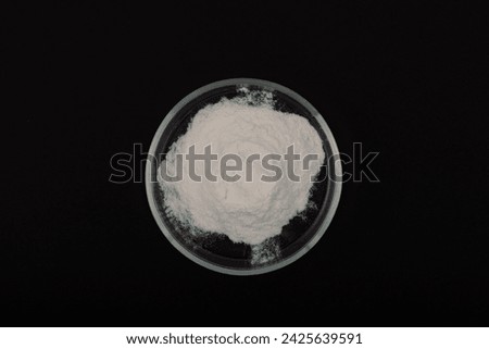 Sodium Carboxymethyl Cellulose, NaCMC in Petri dish. Food additive E466. Carboxymethylcellulose, carmellose, or croscarmellose powder. Stabiliser and Thickener.