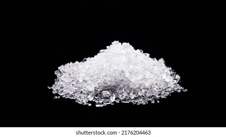 Sodium Chloride, Known As Salt Or Table Salt, An Important Food Preservative And A Popular Seasoning, Isolated On Black Background