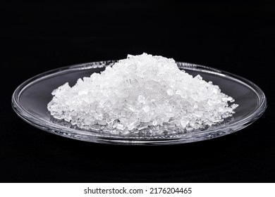 Sodium Chloride, Known As Salt Or Table Salt, An Important Food Preservative And A Popular Seasoning, Isolated On Black Background