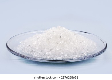 Sodium Chloride, Known As Salt Or Table Salt, Important Food Preservative And Popular Seasoning, Isolated On Blue Background