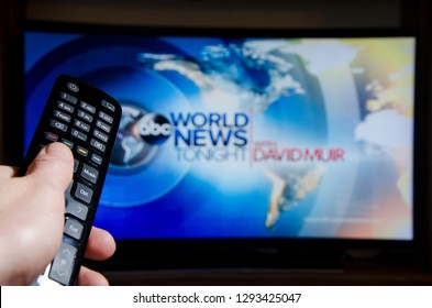 Soest, Germany - January 13, 2019: Man Watching ABC World News Tonight With David Muir On TV.