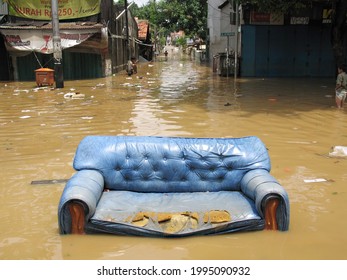 Sofa Carried By Flood Currents During A Flood In Jakarta, Indonesia, February 6, 2007