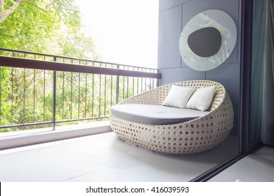 Sofa On The Balcony With Garden View.