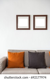 Sofa With Pillow And Photo Fame On White Background