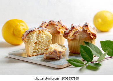 Soffioni - traditional ricotta cheese and lemon cakes. Concept of sweet and easter national pastries.