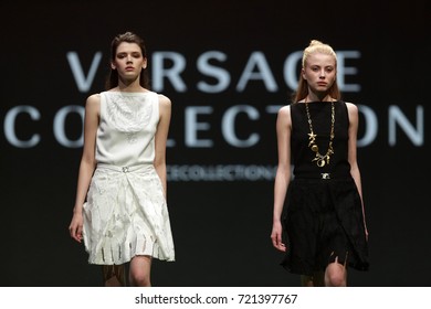 Sofia, Bulgaria - 21 March 2017: Two Female Models Walk The Runway During The Sofia Fashion Show. Fashion Catwalk Event Showing New Collection Of Clothes. Versace Collection.