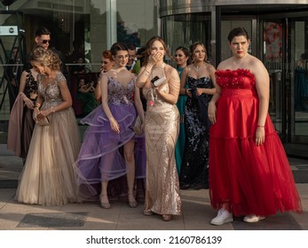 Sofia, Bulgaria - 24.05.2022, A Group Of Girls In Fancy Dresses Stands Near The Entrance Of A Restaurant At Graduate Prom