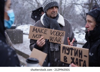 Sofia, Bulgaria - February 27, 2022: People holding posters which says: "Putin in Hague" and "Make vodka, not war", during a protest against the war in Ukraine.