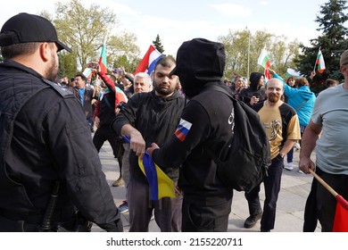 Sofia, Bulgaria - May 09, 2022: Supporters of Russia celebrate Victory Day near the monument to the Soviet army, destroying the Ukrainian flag