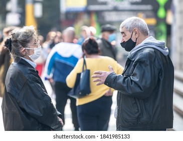 Sofia, Bulgaria - Oct 27: Two Elderly People Speaking Outside Following Government's Order To Wear Masks And Keep Social Distance.