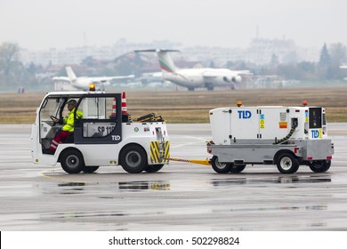 Sofia, Bulgaria - October 16, 2016: Airport Luggage Car At Sofia Airport. Freight Trolley With Loaded Baggage On The Runway.