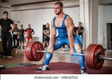 Sofia, Bulgaria - September 23, 2018: Very strong Bulgarian power-lifter champion is making successful deadlift attempt with 310 kg at Bulgarian National Powerlifting Championship Competition.