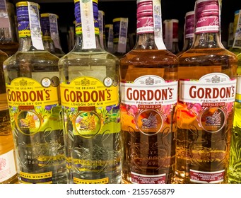 SOFIA,BULGARIA - May 08,2022 :Gordon's  Dry Gin Bottles On A Supermarket Shell . Premium Pink And The Original Yellow Bottle 