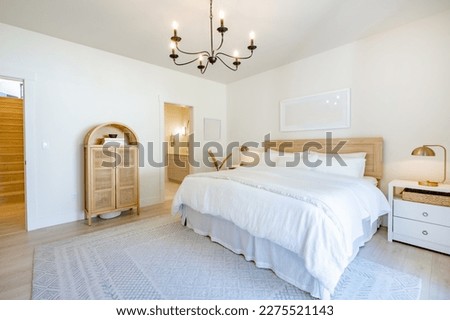 soft and airy bedroom in a modern farmhouse style scandanavian simple decor white linens and bedding
