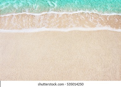 Soft Azure Ocean Waves On Sandy Beach. Background.