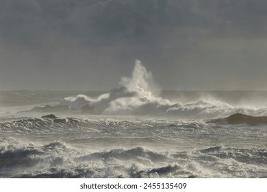 Soft backlit stormy seascape at sunset. Northern portuguese rocky coast seeing a geodesic landmark in winter. - Powered by Shutterstock