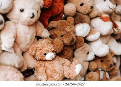  Soft bears toys background in brown, white, beige and gray shades.Teddy bears texture .Symbol of childhood and comfort.White, beige, brown bears set.Childrens soft toys  - Powered by Shutterstock