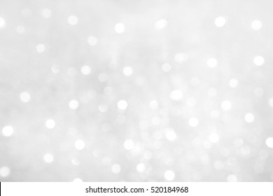 Soft Beautiful Abstract White Grey Background With Bokeh Lights. Beautiful Blurred Winter Background With Copy Space. Grayscale Texture