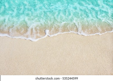 Soft beautiful ocean wave on sandy beach. Background. - Powered by Shutterstock