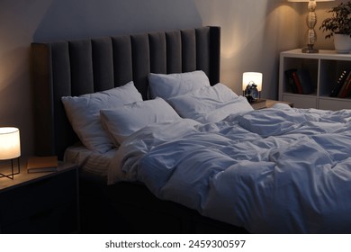 Soft bed, nightlights and cozy furniture indoors