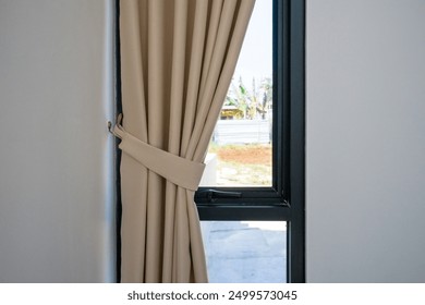 Soft beige curtain with morning sun light shining through white sheer curtain of bedroom window. new day life concept - Powered by Shutterstock