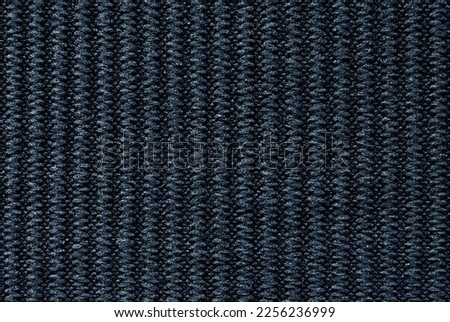 Soft black color ribbed fabric pattern close up as background