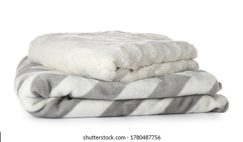 Soft blankets on white background