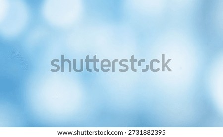 A soft blue background featuring light bokeh effects creates a serene and calming ambiance. The blurred visual effect enhances the overall aesthetic appeal.