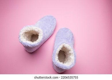 Soft Blue Homemade Ugg Boots On A Pink Background.