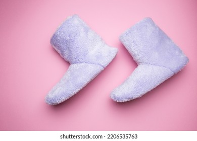 Soft Blue Homemade Ugg Boots On A Pink Background.