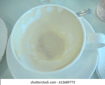 soft blue tone, empty cup of hot coffee