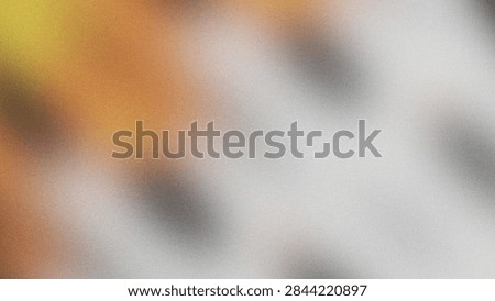 Soft blurred abstract texture featuring gradient colors and subtle shapes
