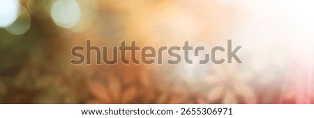 A soft, blurred background with warm orange tones. The background features a gentle gradient and bokeh effect, highlighting the orange color. Autumn foliage background, autumn aesthetic.