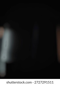 Soft blurred dark background with subtle bokeh and light leaks. Elegant abstract texture for overlays, wallpapers, or moody creative designs.