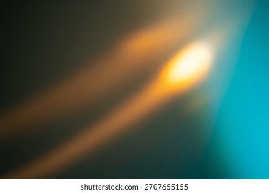 soft, blurred light patterns blend warm orange and cool teal tones, creating an abstract composition that evokes a sense of movement and depth, neutral background, clear negative space, clean