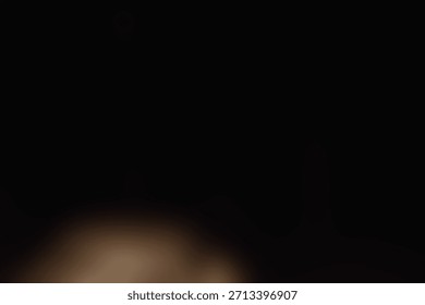 Soft blurred warm light floating in deep darkness. 