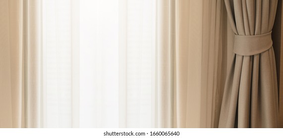 soft brown curtain with morning light from window bedroom background banner header size image