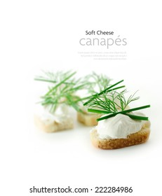 Soft Cheese Canapes With Chives And Dill Herb Garnish Against A White Background With A Shallow Depth Of Field. Copy Space.