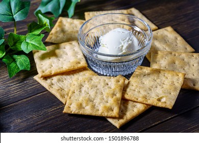 Soft Cheese And Crackers On Wooden Background