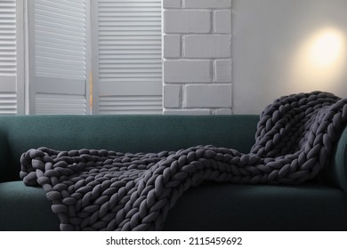 Soft Chunky Knit Blanket On Sofa In Room
