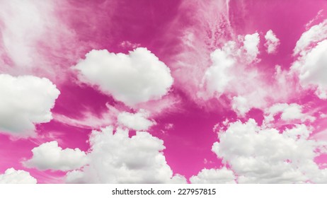 A soft cloud background with a pastel colored orange to blue gradient.