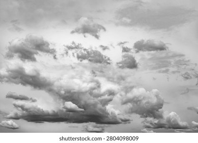 Soft clouds drift across the sky. Layers of grey formations create depth. Varying textures show cloud movement. Ideal for weather themes or nature backgrounds