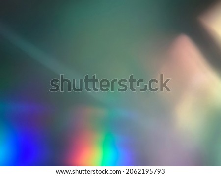 Soft color streaks and rainbow light glares around the edge for overlay of background