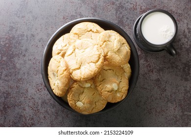 Soft Cookies With Macadamia Nuts And White Chocolate Served With Milk Close-up On The Table. Horizontal Top View From Above
