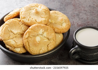 Soft cookies with macadamia nuts and white chocolate served with milk close-up on the table. horizontal
 - Powered by Shutterstock