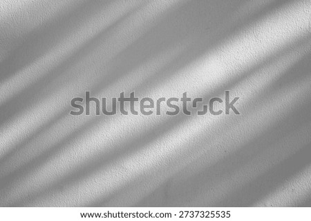 Soft Diagonal Window Shadows on Minimalist White Textured Wall Background