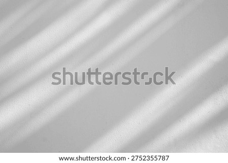 Soft Diagonal Window Shadows on Minimalist White Textured Wall Background