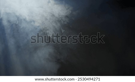Soft diffused rays of light cut through the hazy darkness.