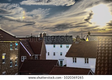 Soft dream-like image of a modern suburban housing estate. Dark dreamy and surreal picture of contemporary living.